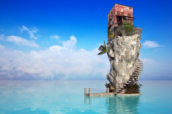 Maison sur un rocher au milieu de la mer