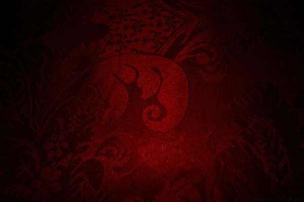 Ancien symbole sur fond rouge