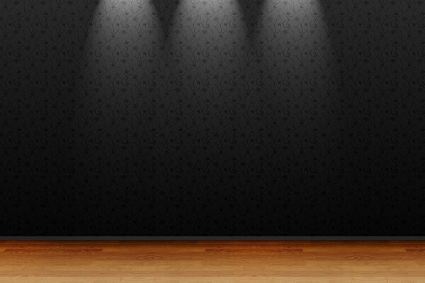 Mur gris sur lequel brillent trois lampes