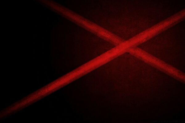 Sur un fond sombre, les lignes rouges dé à coudre