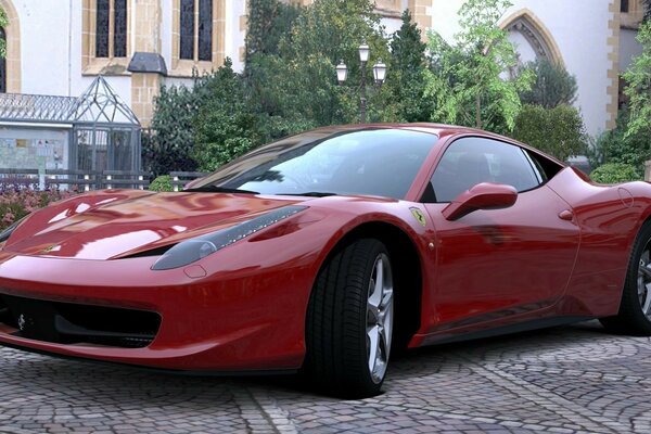 Voiture de sport rouge dans la cour garée