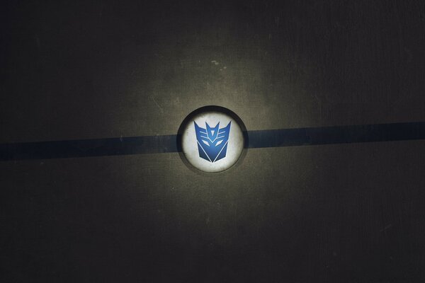 Signe de Transformers bleu sur fond blanc